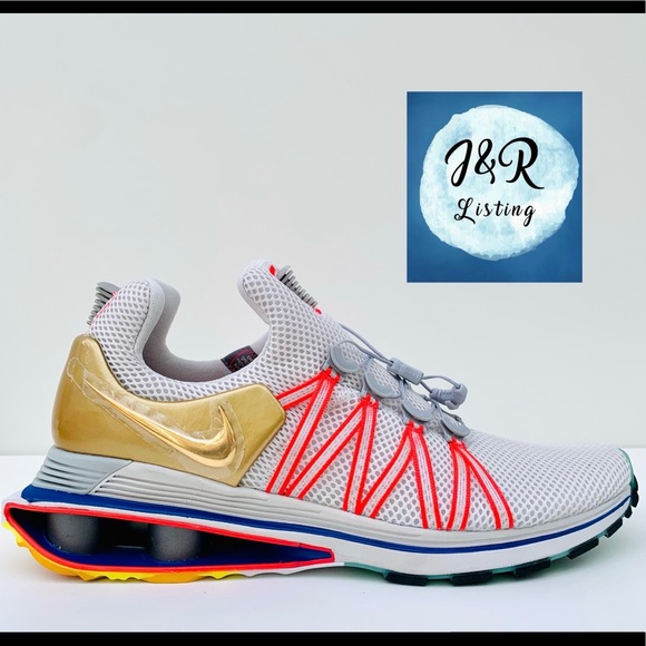 nike shox gravity metallic gold women's shoe